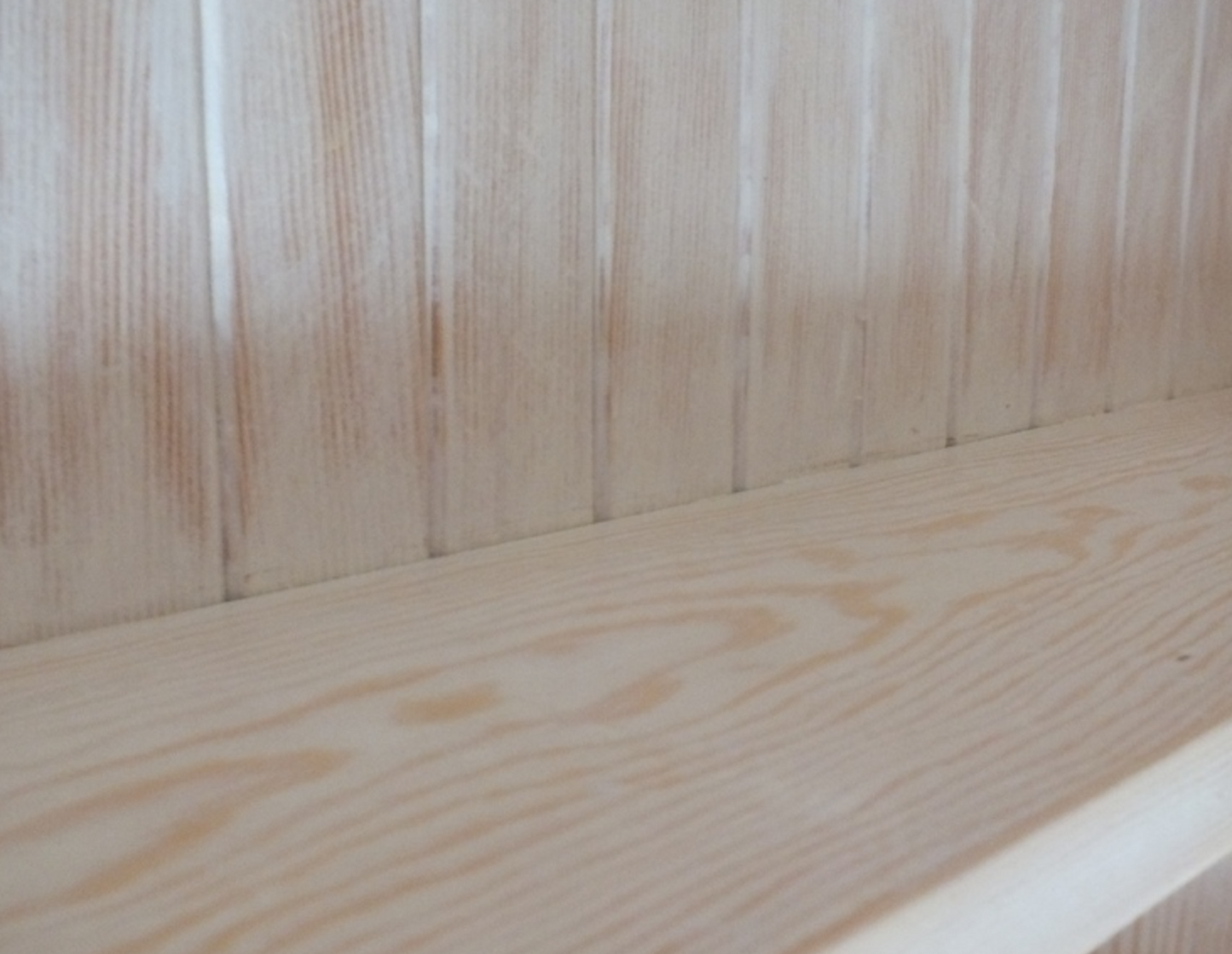 Close-up of a wooden surface with visible grain and texture