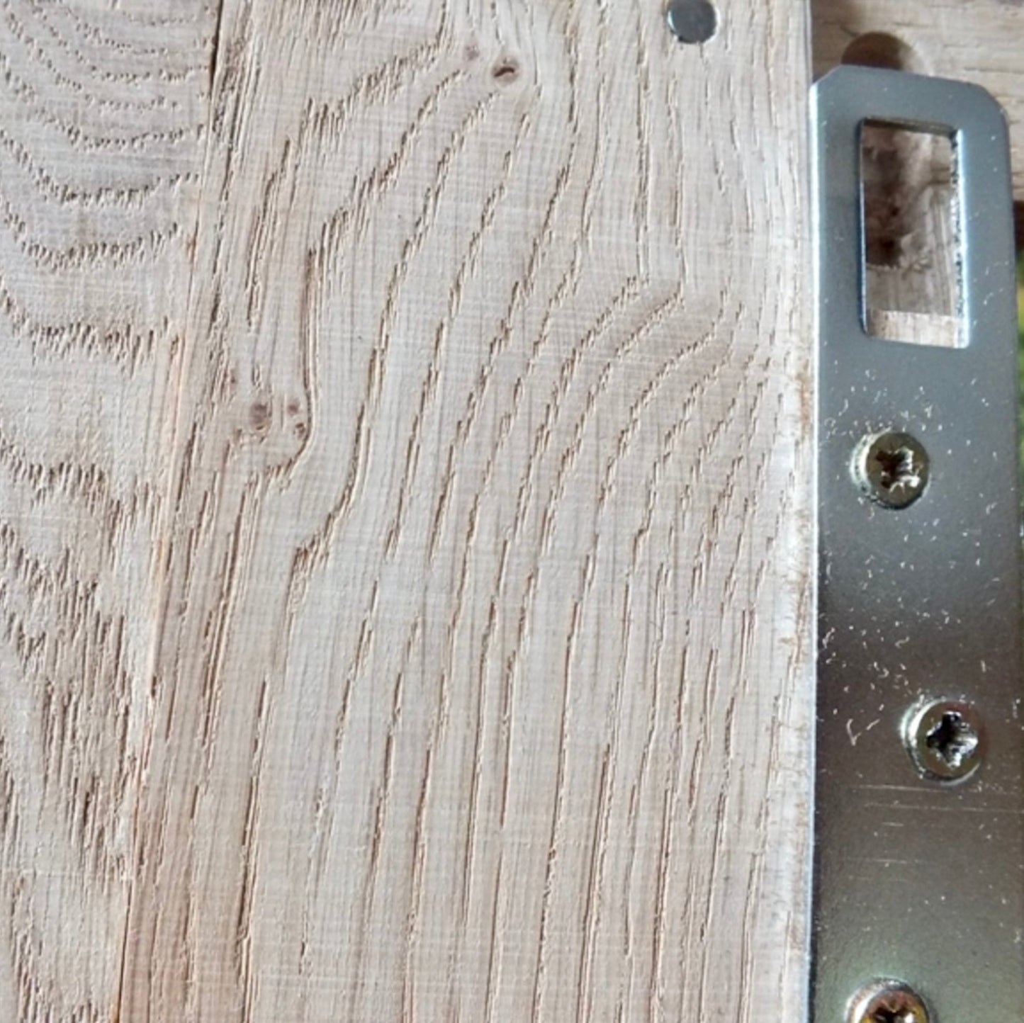 Wooden surface with a metal bracket attached