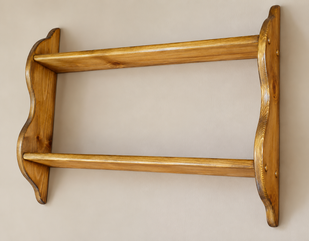 A rustic wooden wall-mounted shelf with two horizontal slats and decorative wavy brackets on the sides, shown against a plain beige wall.