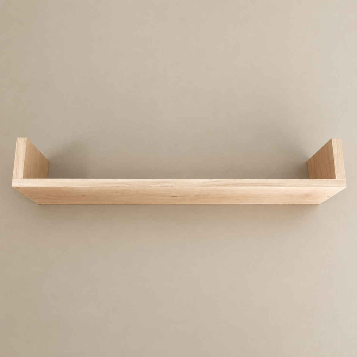A minimalist light natural wood floating shelf with two vertical backer supports, shown against a solid warm beige wall.