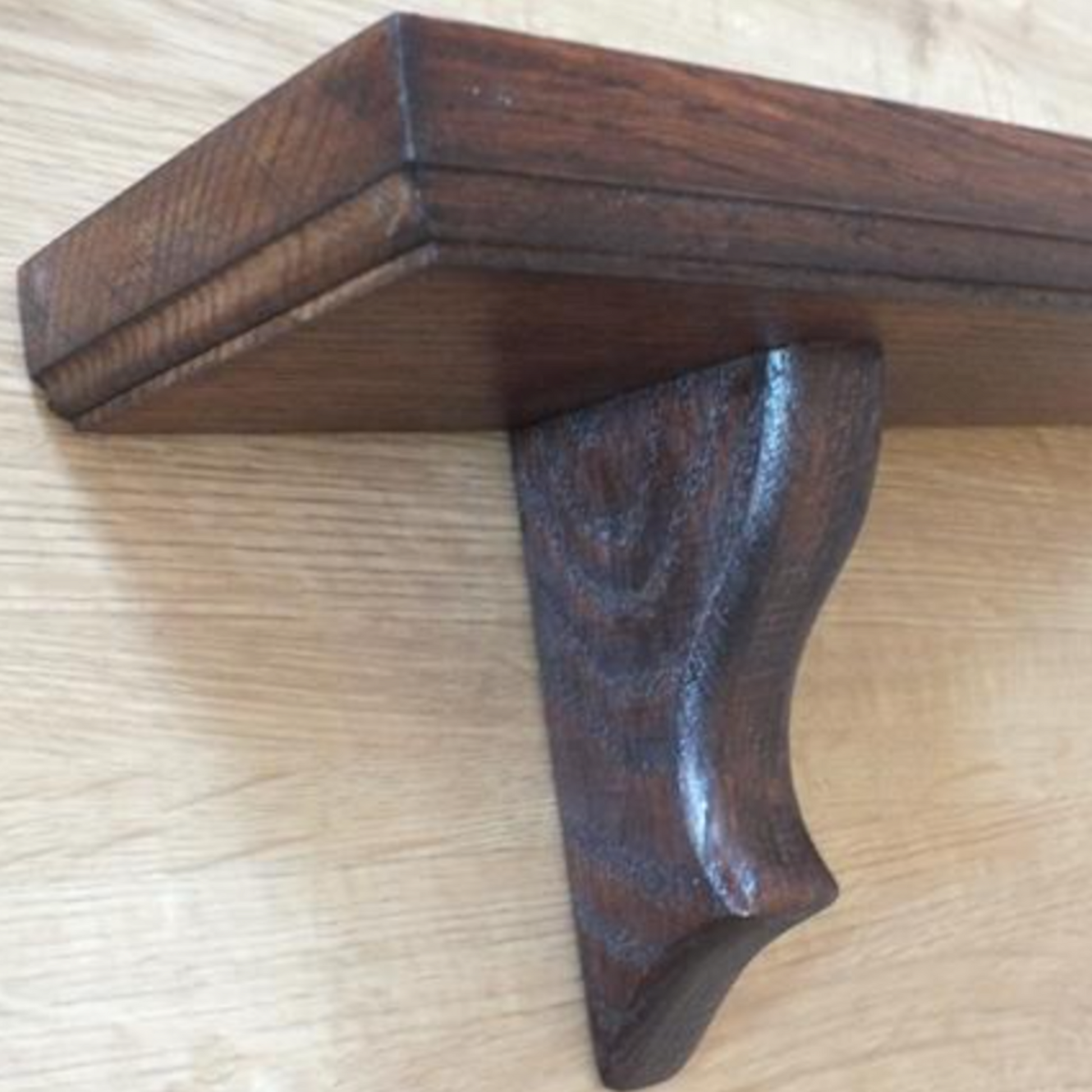 Wooden gun stock on a light wooden surface