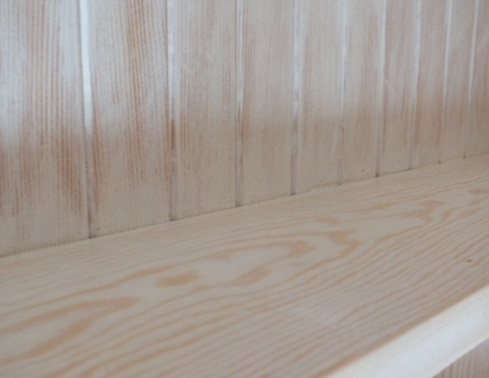 Close-up of a wooden surface with visible grain and texture