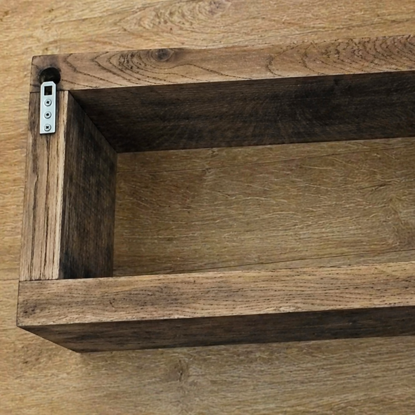 Wooden shelf with a rustic finish on a wooden surface