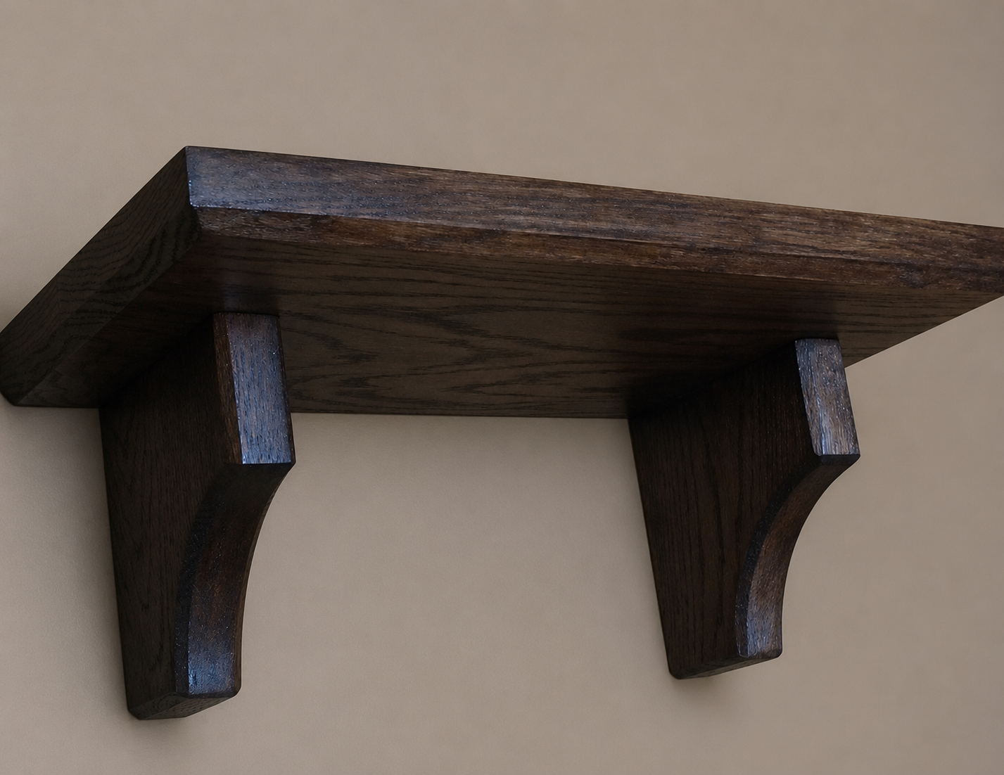 Wooden shelf with corbels on a beige background