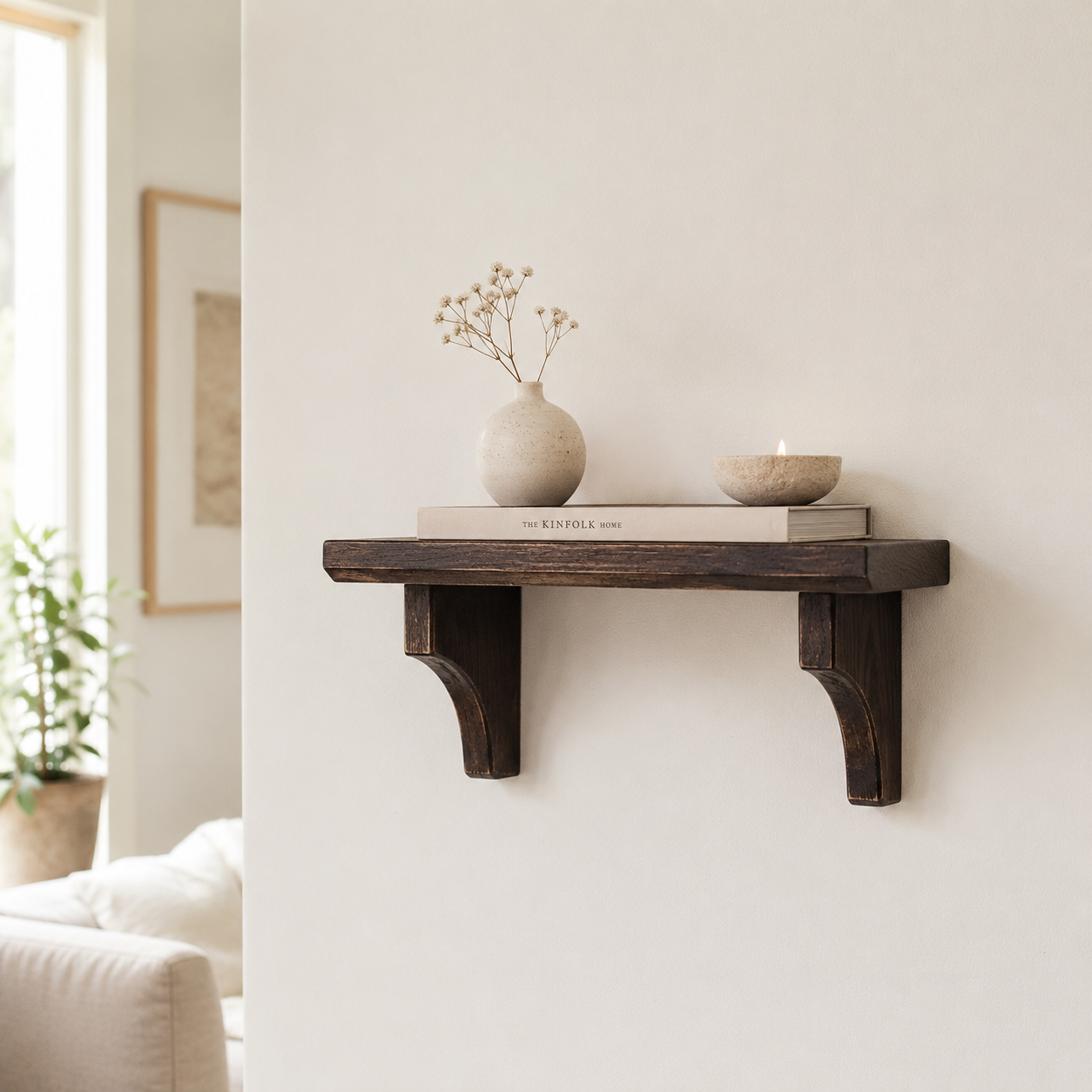 Wooden shelf with decorative items against a light wall