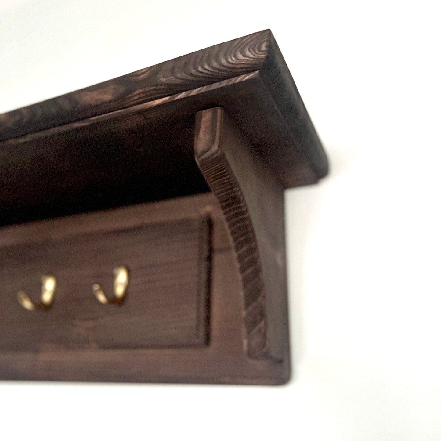Wooden jewelry box with a lid on a white background