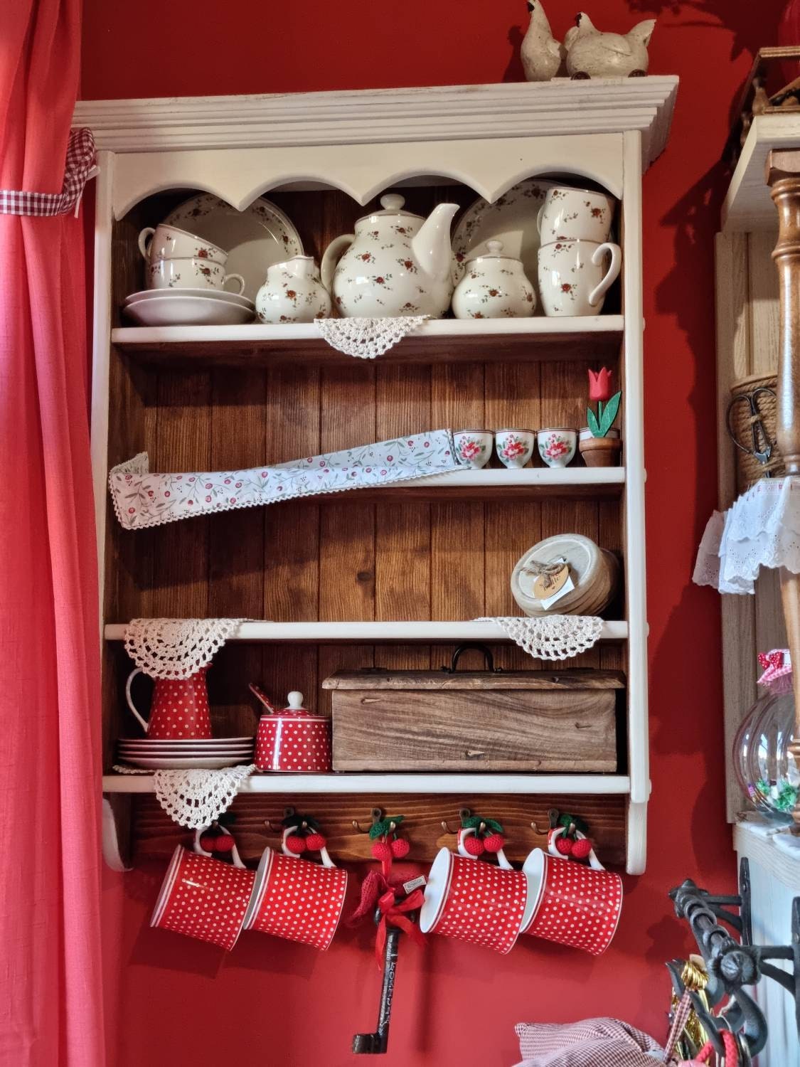 s91 Wall mounted kitchen open shelving with decorative top panel and hooks on the bottom panel