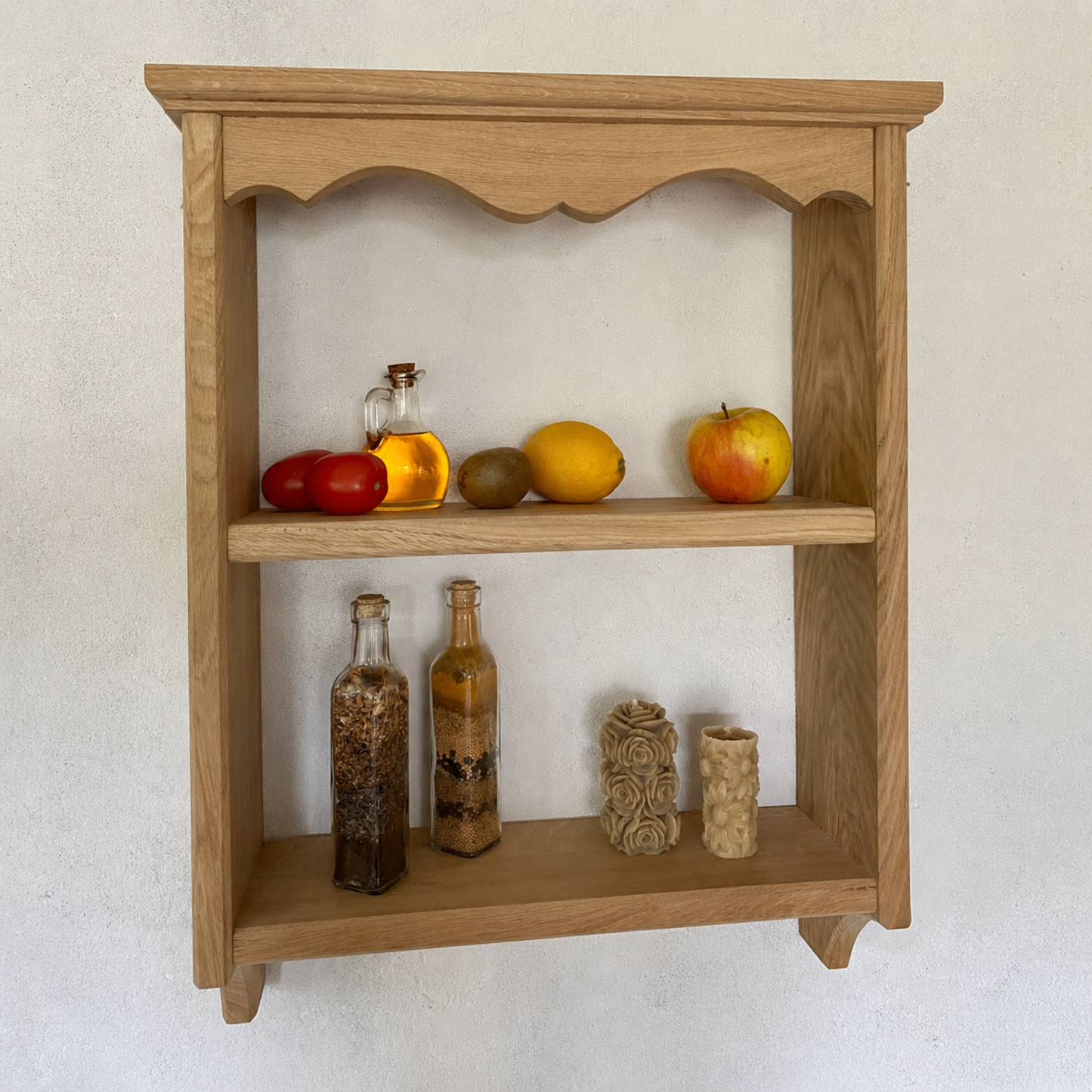 Wooden shelf with decorative items against a white wall