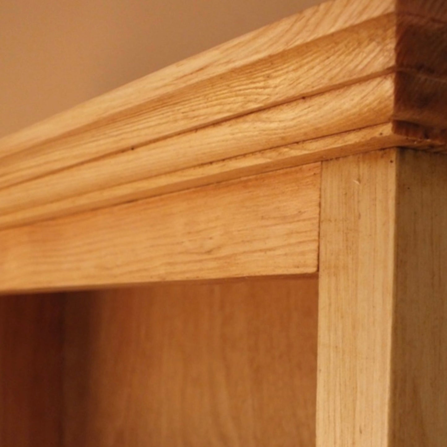 Close-up of a wooden shelf with a focus on the joinery.