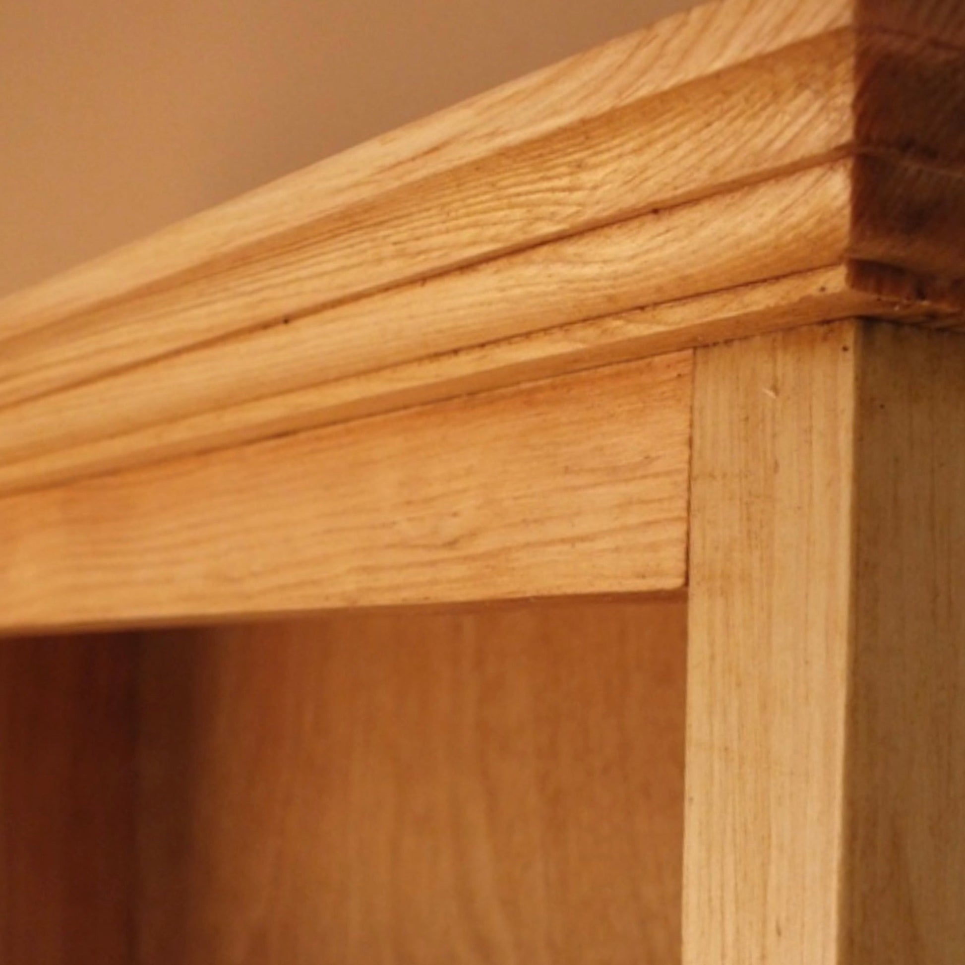 Close-up of a wooden shelf with a focus on the joinery.