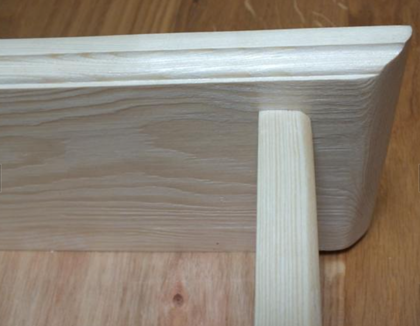 Wooden box with a handle on a wooden surface