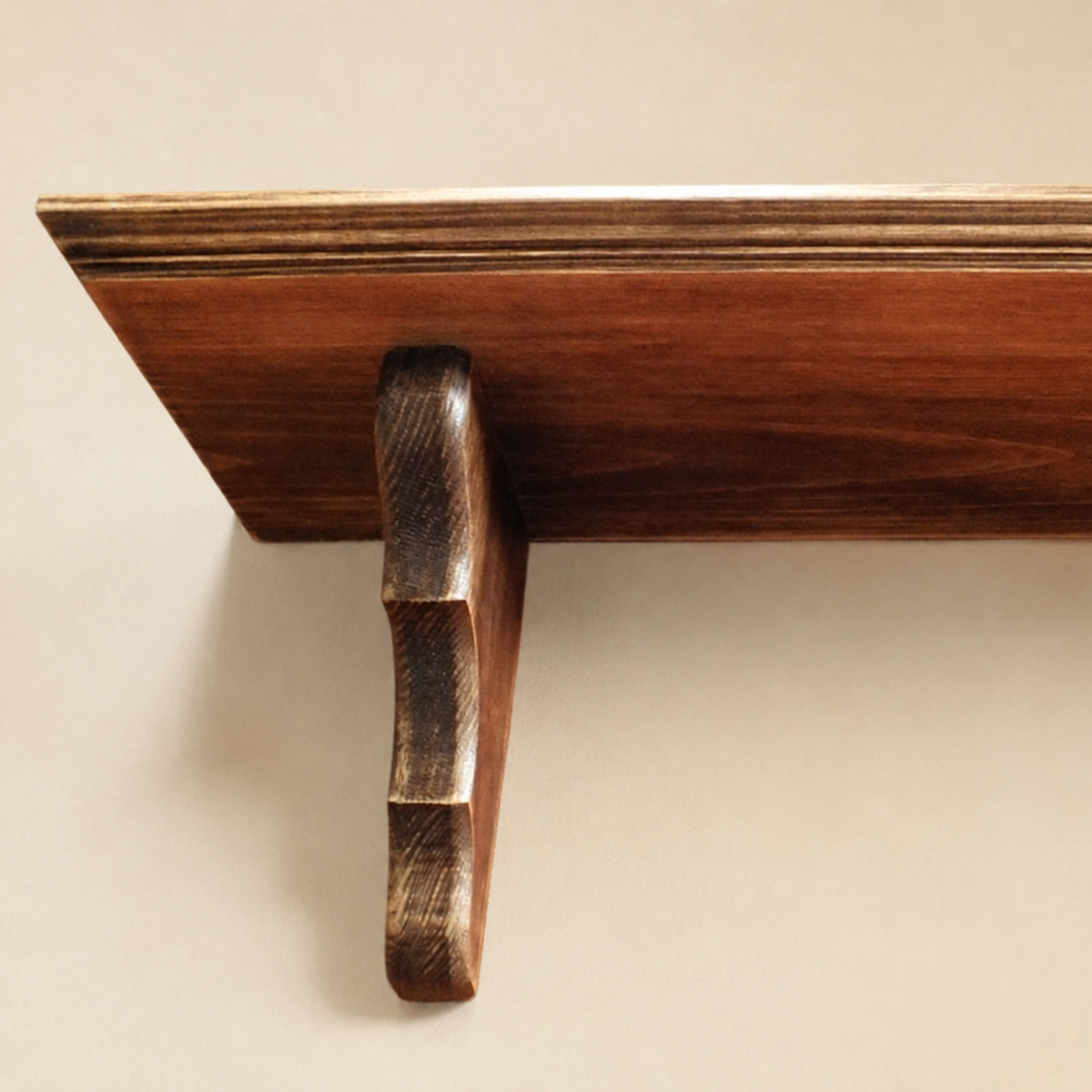 Wooden shelf bracket on a beige background