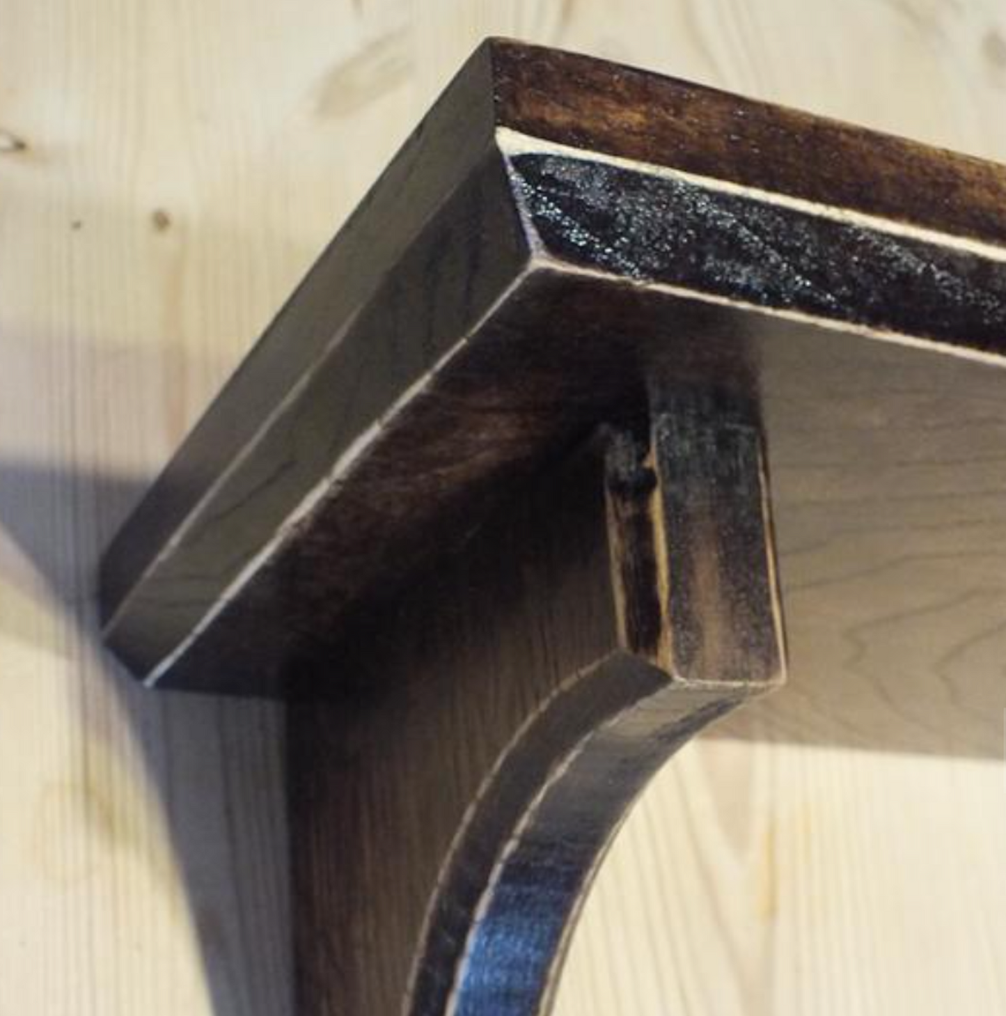 Wooden bracket on a wooden surface